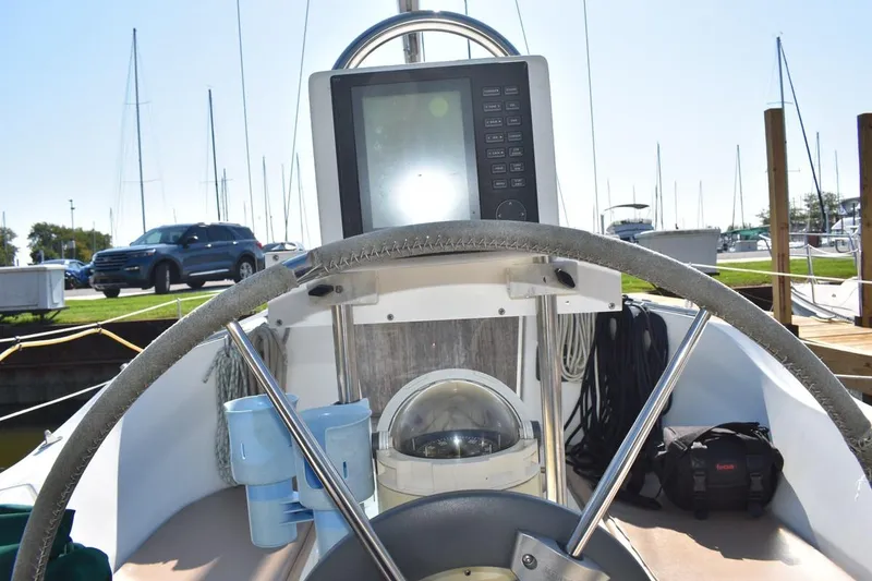 Slide: The Image of Cockpit view of 1996 Beneteau Oceanis 321 sailboat with navigation equipment. - 17