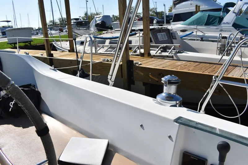 Slide: The Image of Beneteau Oceanis 321 sailboat, 1996 model, docked at marina with wooden pier. - 18