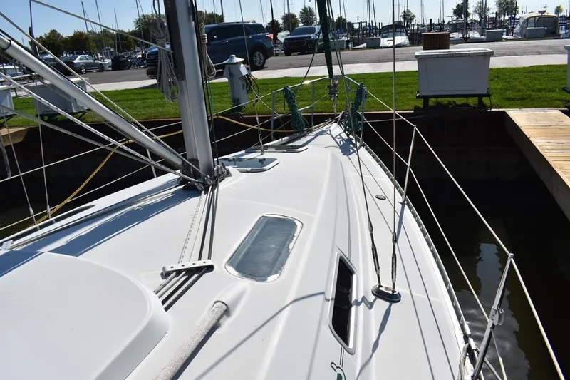 Slide: The Image of 1996 Beneteau Oceanis 321 sailboat docked, showcasing deck and rigging details. - 22