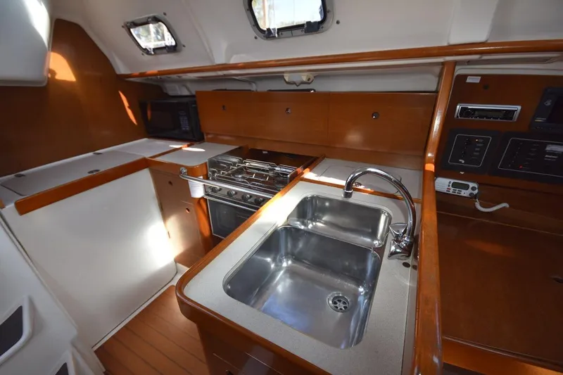 Slide: The Image of Interior of 1996 Beneteau Oceanis 321 yacht kitchen with sink and stove. - 34