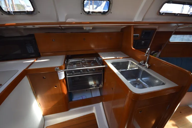 Slide: The Image of Interior of 1996 Beneteau Oceanis 321 yacht kitchen with stove and sink. - 35