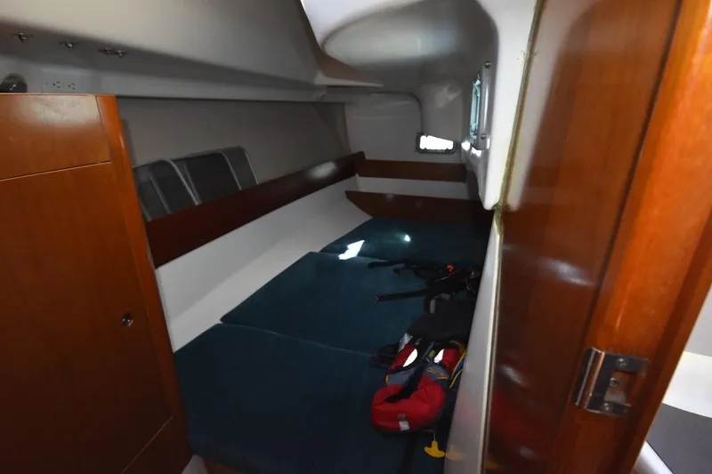 Slide: The Image of Interior cabin of 1996 Beneteau Oceanis 321 sailboat with cozy sleeping area. - 40