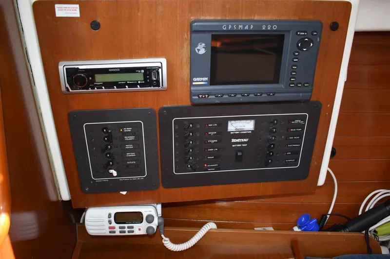 Slide: The Image of Control panel of a 1996 Beneteau Oceanis 321 sailboat with GPS and radio equipment. - 46