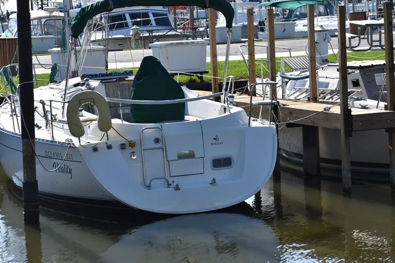 Slide: The Image of 1996 Beneteau Oceanis 321 sailboat docked at marina, rear view. - 5