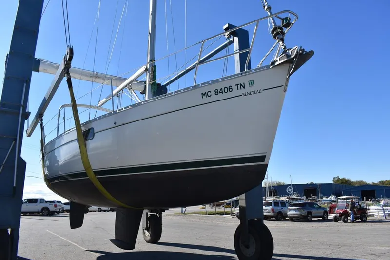 Slide: The Image of Beneteau Oceanis 321 sailboat from 1996 being lifted at a marina. - 51