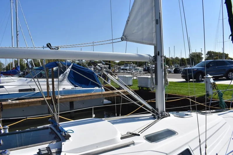Slide: The Image of 1996 Beneteau Oceanis 321 sailboat docked at marina on a sunny day. - 9