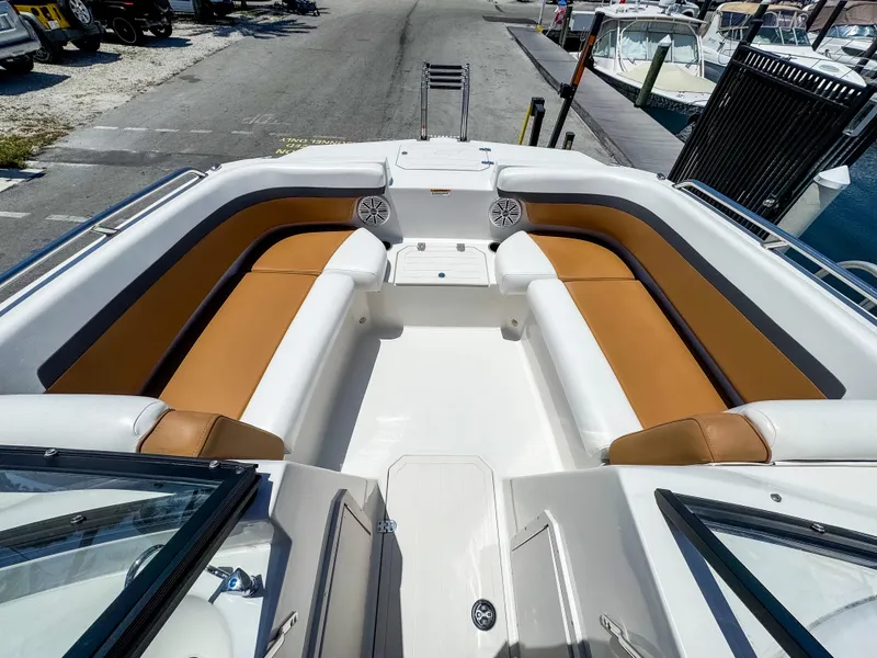 Slide: The Image of 2023 Starcraft SVX 190 OB boat interior with tan seating and speakers. - 12