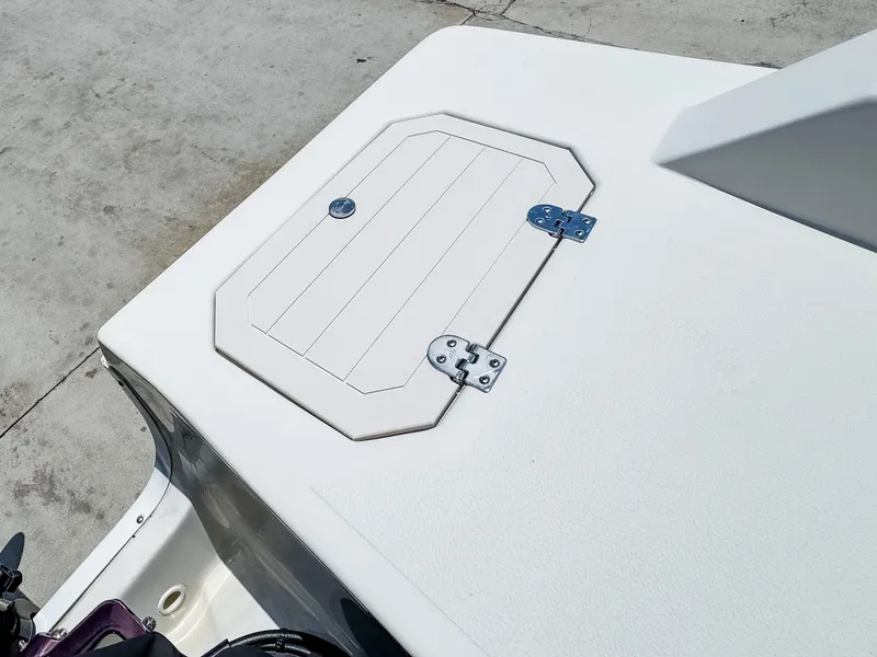 Slide: The Image of 2023 Starcraft SVX 190 OB boat hatch on a clean white deck. - 17