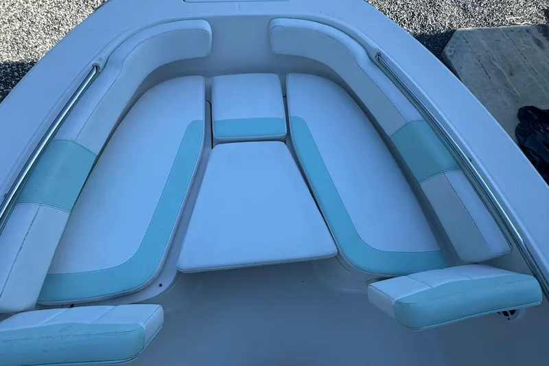 Slide: The Image of 2021 Robalo R200 Center Console boat with cushioned seating area. - 14