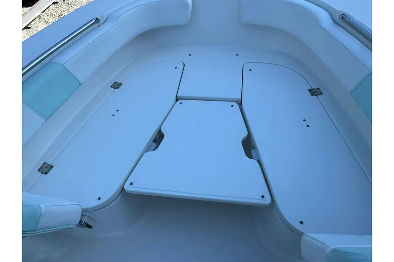 Slide: The Image of 2021 Robalo R200 Center Console boat seating area with storage compartments. - 15