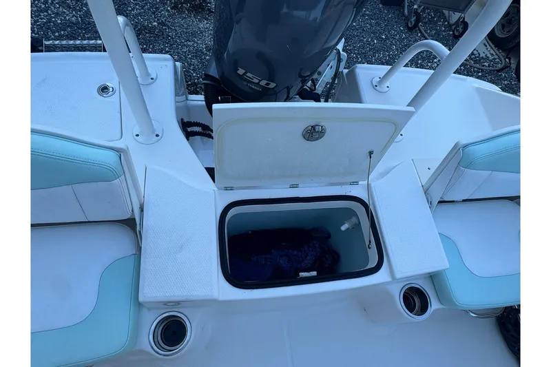 Slide: The Image of 2021 Robalo R200 Center Console boat with open storage compartment and seating. - 18