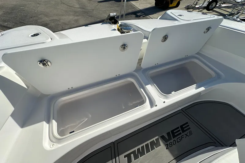 Slide: The Image of 2026 Twin Vee 280 GFX2 CC boat storage compartments open, showcasing spacious design. - 10