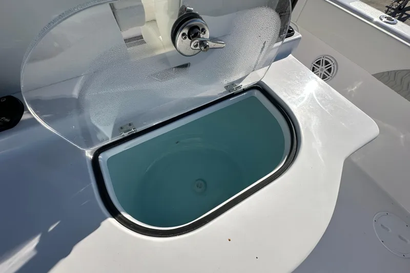 Slide: The Image of Livewell on 2026 Twin Vee 280 GFX2 CC boat, open lid, clear water inside. - 17