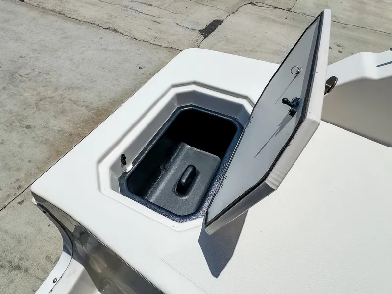Slide: The Image of 2023 Starcraft SVX 190 OB boat storage compartment with open lid. - 18