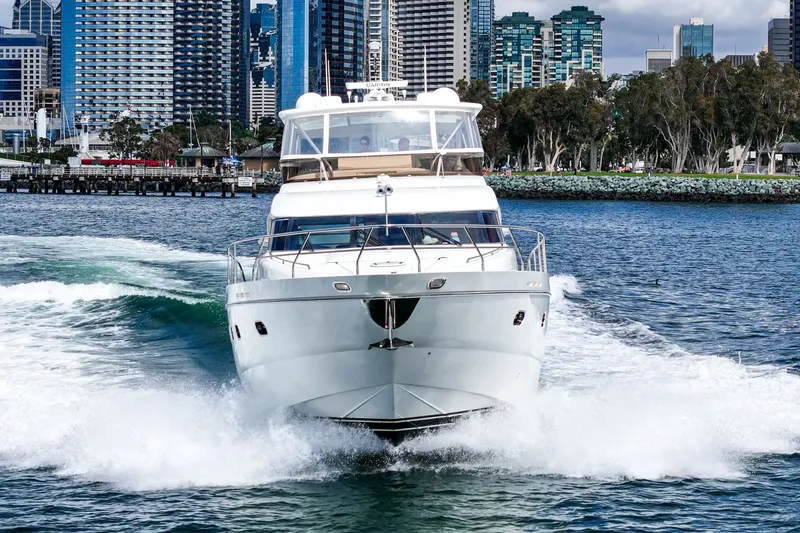Slide: The Image of 2007 Princess 75 Fly luxury yacht cruising near city skyline. - 16
