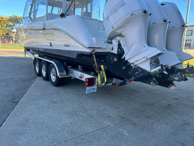Slide: The Image of 2012 Everglades 350LX boat on trailer with dual outboard engines. - 20