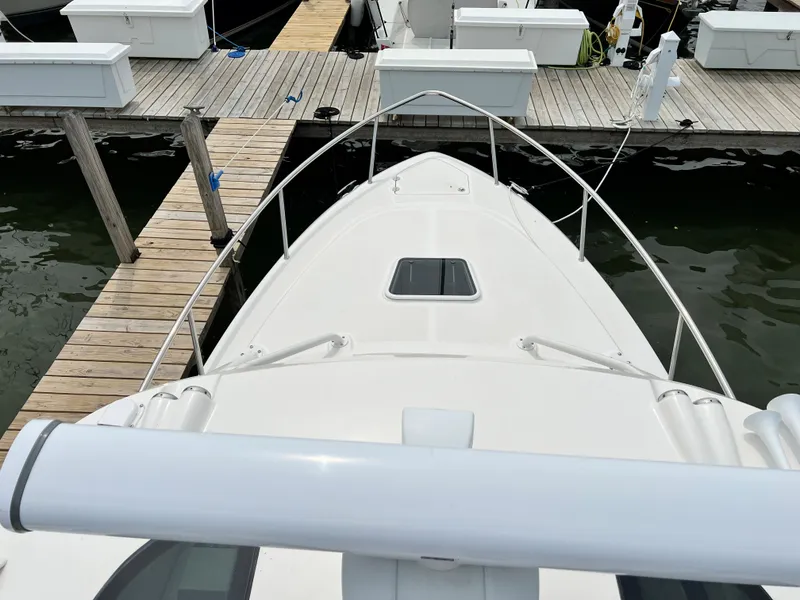 Slide: The Image of Bow view of 2012 Everglades 350LX boat docked at a marina. - 39