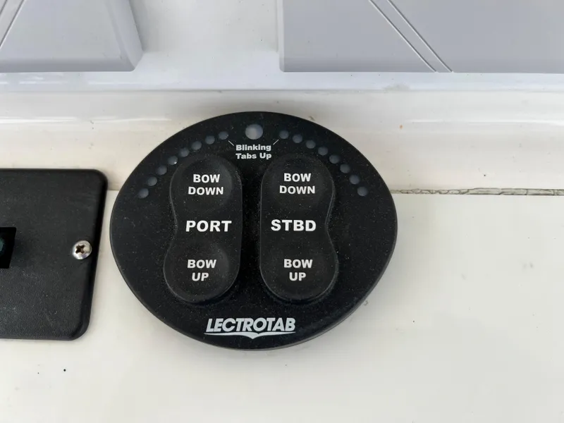 Slide: The Image of Control panel for Everglades 350LX 2012 boat with Lectrotab trim tab buttons. - 45