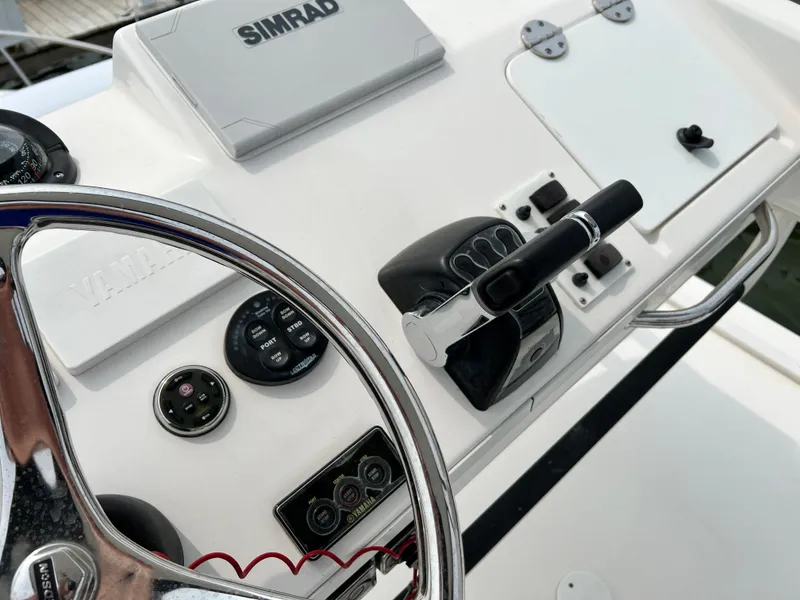 Slide: The Image of Control panel of a 2012 Everglades 350LX boat with Simrad navigation system. - 46