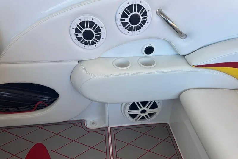 Slide: The Image of Interior of a 2005 Baja 342 boat with speakers and cup holders. - 18