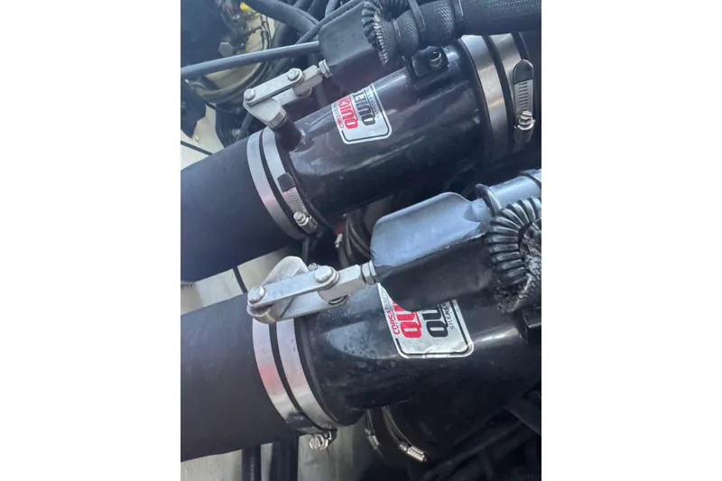 Slide: The Image of Close-up of 2005 Baja 342 engine components with clamps and hoses. - 32