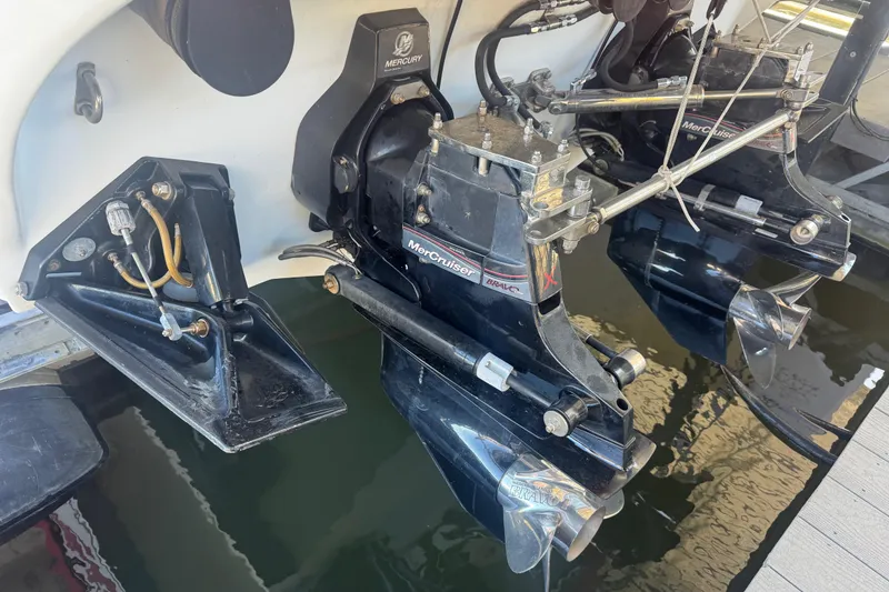 Slide: The Image of 2005 Baja 342 boat with dual MerCruiser Bravo X outdrives in water. - 34