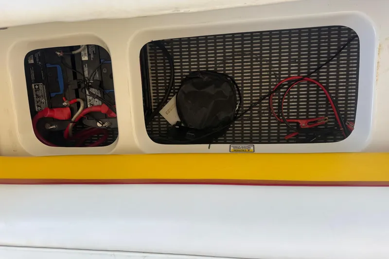 Slide: The Image of 2005 Baja 342 boat battery compartment with cables and equipment. - 37
