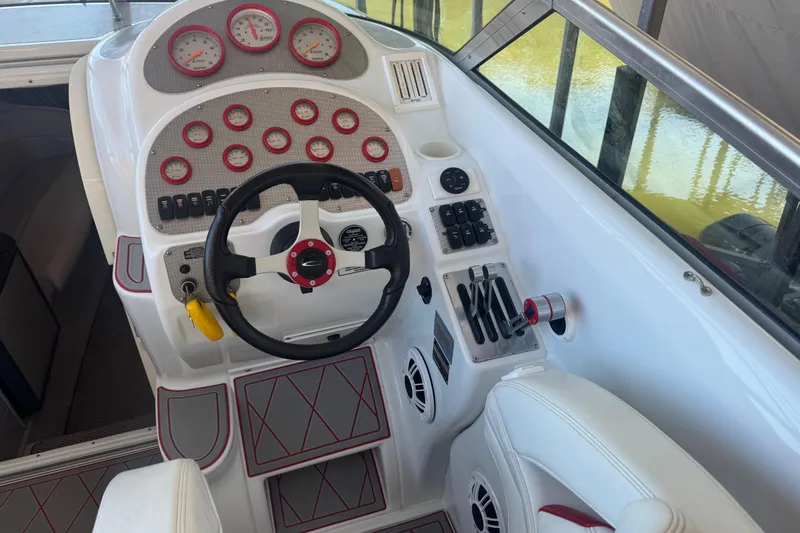 Slide: The Image of Cockpit of 2005 Baja 342 boat with steering wheel and control panel. - 9