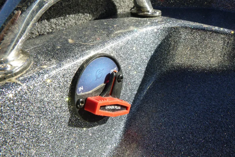 Slide: The Image of Close-up of a 2026 Ranger 2080MS boat drain plug control. - 11