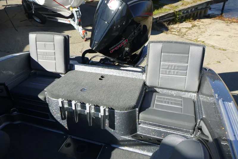 Slide: The Image of 2026 Ranger 2080MS boat interior with seating and Mercury outboard motor. - 14