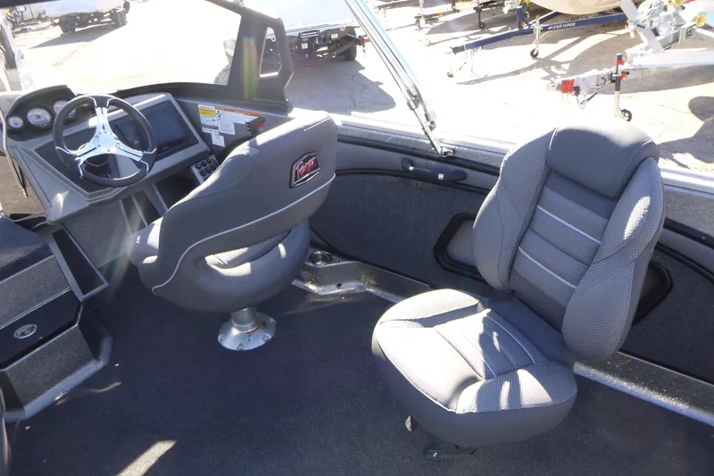 Slide: The Image of Interior of 2026 Ranger 2080MS boat with modern seating and steering console. - 17