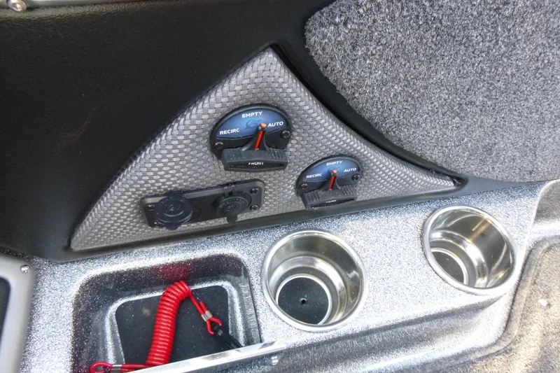 Slide: The Image of Control panel of 2026 Ranger 2080MS boat with cup holders and switches. - 22