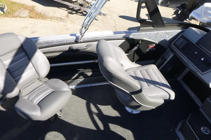 Slide: The Image of Interior of 2026 Ranger 2080MS boat with two gray seats and dashboard. - 25
