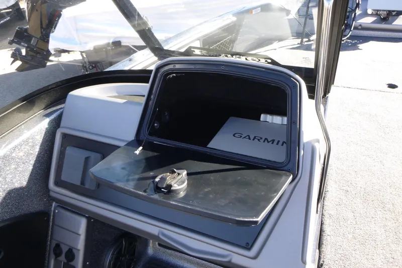 Slide: The Image of 2026 Ranger 2080MS boat dashboard with Garmin device in storage compartment. - 28