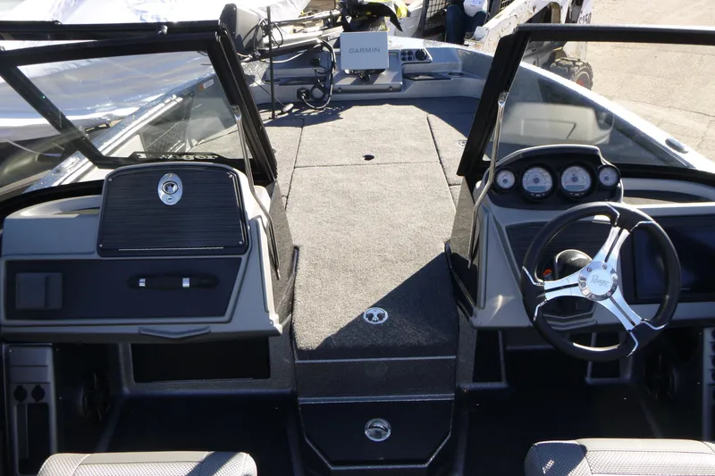 Slide: The Image of Interior view of 2026 Ranger 2080MS boat with steering wheel and dashboard controls. - 29