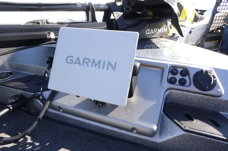 Slide: The Image of Garmin device on 2026 Ranger 2080MS boat dashboard, featuring control buttons. - 33