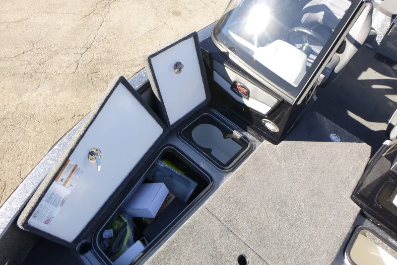 Slide: The Image of 2026 Ranger 2080MS boat interior with open storage compartments and seating. - 36