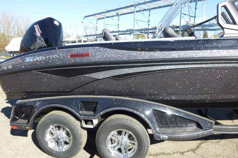 Slide: The Image of 2026 Ranger 2080MS boat with glittery black finish on a dual-axle trailer. - 5