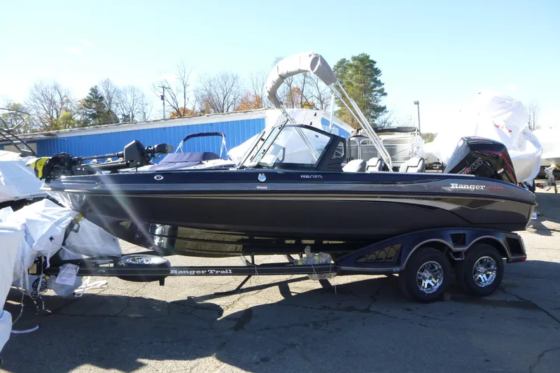 Slide: The Image of 2026 Ranger 2080MS boat on trailer, parked outdoors, with clear sky background. - 6