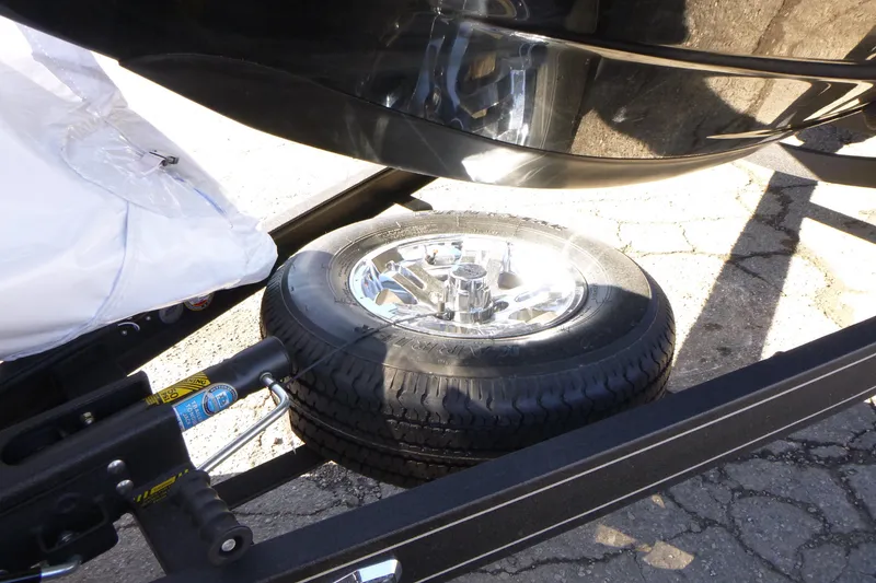 Slide: The Image of Spare tire mounted on a Ranger 2080MS trailer, 2026 model, with shiny chrome rim. - 7