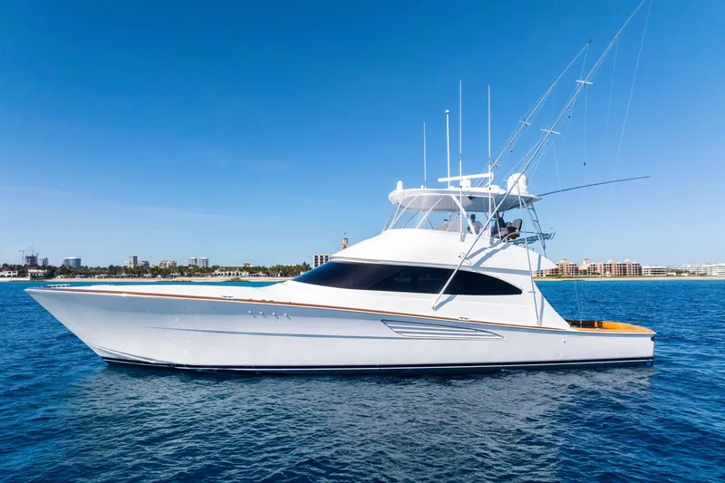 The Image of 2025 Viking 64 Convertible yacht on calm blue ocean waters. - 0