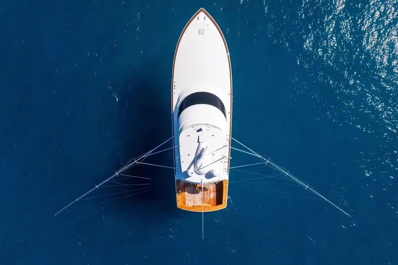Slide: The Image of Aerial view of 2025 Viking 64 Convertible yacht on blue ocean water. - 11
