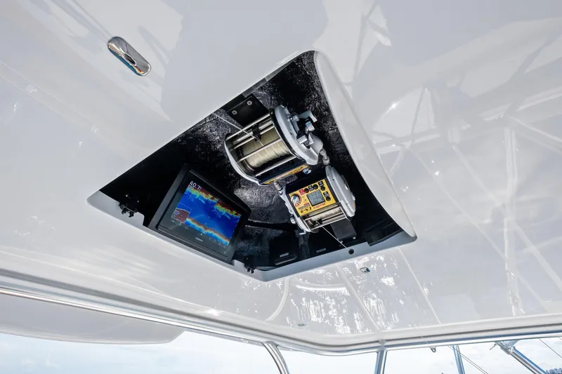 Slide: The Image of 2025 Viking 64 Convertible yacht with advanced navigation and fishing equipment. - 16