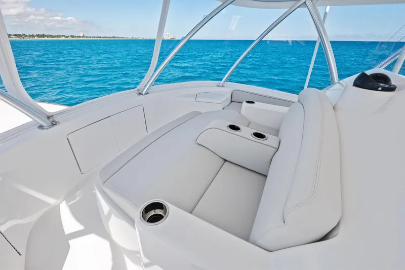 Slide: The Image of 2025 Viking 64 Convertible yacht interior with luxurious seating and ocean view. - 20