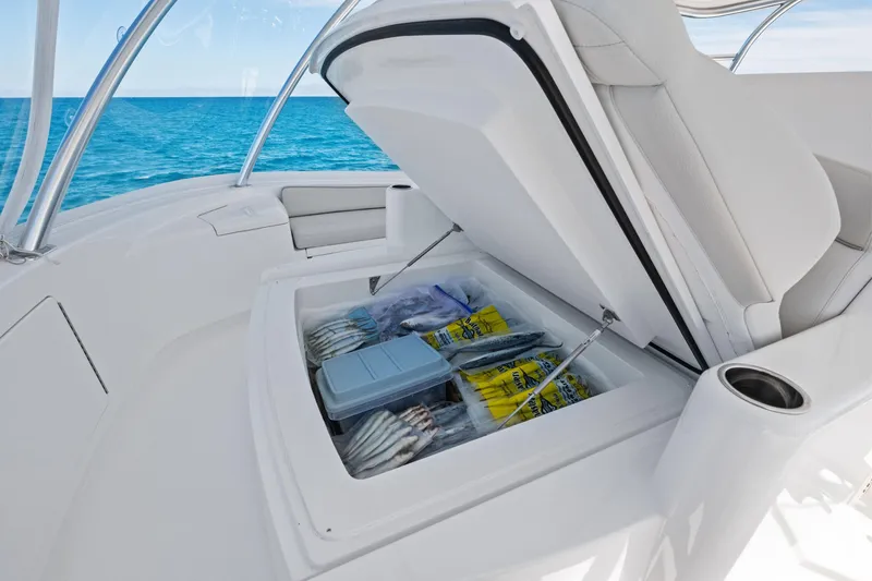 Slide: The Image of Open storage compartment on 2025 Viking 64 Convertible yacht, with ocean view. - 21