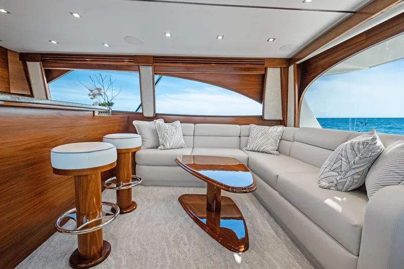 Slide: The Image of Luxurious interior of 2025 Viking 64 Convertible yacht with elegant seating and ocean view. - 23
