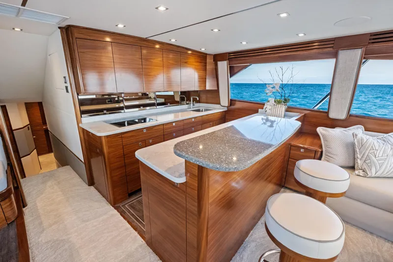 Slide: The Image of Luxurious interior of 2025 Viking 64 Convertible yacht with ocean view. - 26