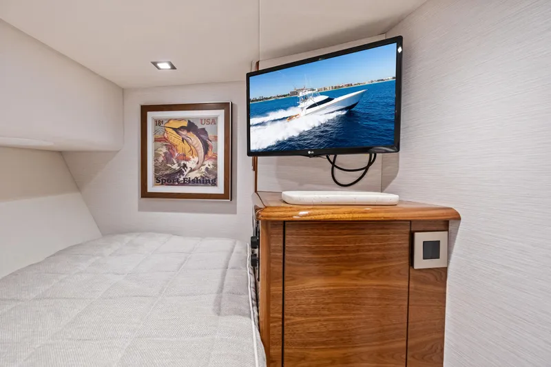 Slide: The Image of Interior of 2025 Viking 64 Convertible yacht with TV and sport fishing decor. - 37