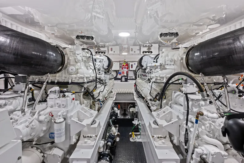 Slide: The Image of Engine room of 2025 Viking 64 Convertible yacht, showcasing advanced machinery and design. - 43