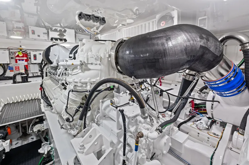 Slide: The Image of Engine room of 2025 Viking 64 Convertible yacht, showcasing advanced machinery and components. - 45